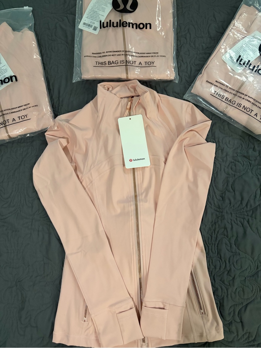 Pink Lululemon Define Jacket with Gold zipper and gold pocket zipper